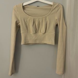 Beige cropped long sleeve top